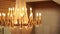 Antique large crystal chandelier with pendants and candles.