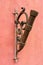 Antique looking flagpole holder on the house wall