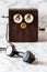 Antique Magneto Hand Crank Telephone Set on Marble Background