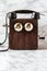 Antique Magneto Hand Crank Telephone Set on Marble Background