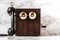 Antique Magneto Hand Crank Telephone Set on Marble Background