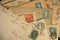 Antique mail with hand cancelled stamps and cachet on yellowed envelopes