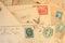 Antique mail with hand cancelled stamps and cachet on yellowed envelopes