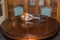 Antique Mandolin on Wooden Round Table with Two Chairs