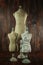 Antique Mannequin Busts on Wood Grunge Background