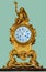 Antique mantel clock with golden angel statuette