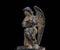 Antique medieval statue of a cemetery angel