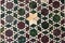 antique medium close up of pale multicolor geometrically patterned marble mosaic floor background