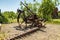 Antique metal mechanical device on wheels for agriculture