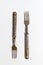 Antique metal rusty fork on a white background