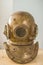 Antique metal scuba helmet, heavy diving equipment with air supp