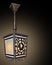 Antique metallic ceiling lantern with glass on a black background