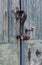 Antique old blue wood door with origin doorknocker