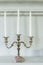 Antique old candlestick with white candles  interior for home and living architecture retro style decoration