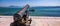 Antique old cannon pointing to the sea boat