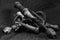 Antique old-style manual hand drill in black and white image