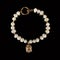 Antique pearl bracelet with buddha head. antique bracelet on black isolated background