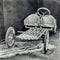 Antique photography of a pedal car without petrol engine.