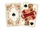 Antique playing cards showing an ace and king of spades.