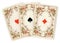 Antique playing cards showing three aces.