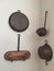 Antique pots and pans on white wall