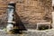 Antique public drinking fountain on the streets of Rome