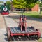 An antique railroad handcar in a park