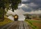Antique Restored Steam Freight Train Approaching Head on Blowing Smoke and Steam