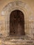 Antique Romanesque wooden arch door with date 1597