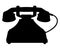 Antique rotary dial telephone with a wire. Vector silhouette illustration