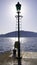 Antique sea street lamp with ladders on the seaside - Rose Village, Lustica peninsula, Kotor Bay, Montenegro, Europe