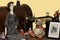 Antique sewing machine decorated with doll, mouse and embroidered picture