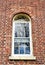 Antique Shaker window in historic brick Watervliet building