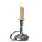 An antique silver candlestick with a burning candle.