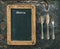 Antique silver cutlery and blackboard. Vintage style. Food conce