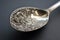 antique silver spoon with intricate carving on the handle