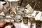 Antique silver teapots, creamer and other utensils at a flea market