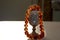 Antique silver wine glass and beads made of natural amber