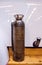 Antique Soda-acid fire extinguisher in a brass container