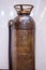 Antique Soda-acid fire extinguisher in a brass container