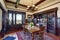 Antique style dining room interior with fresh flowers on the table.