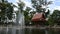 Antique style pavilion and fountain in water pond pool  in garden patio park