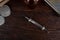 Antique syringe on a wooden table