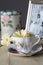 Antique Teacup and Framed Photograph With Yellow Daisy Flowers