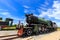 Antique team trains in the station with blue sky