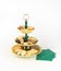 Antique Three Tier Server Tray with an Assortment of Cookies and Napkins.