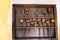 Antique tools for engraving and printing in a wooden case. Tools