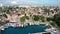 Antique touristic European city marine bay with water transport yacht boat ship aerial panorama view