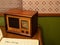 Antique transistor radio sitting in a child`s room with a diary