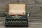 antique typewriter with grungy textured paper page. vintage style still life